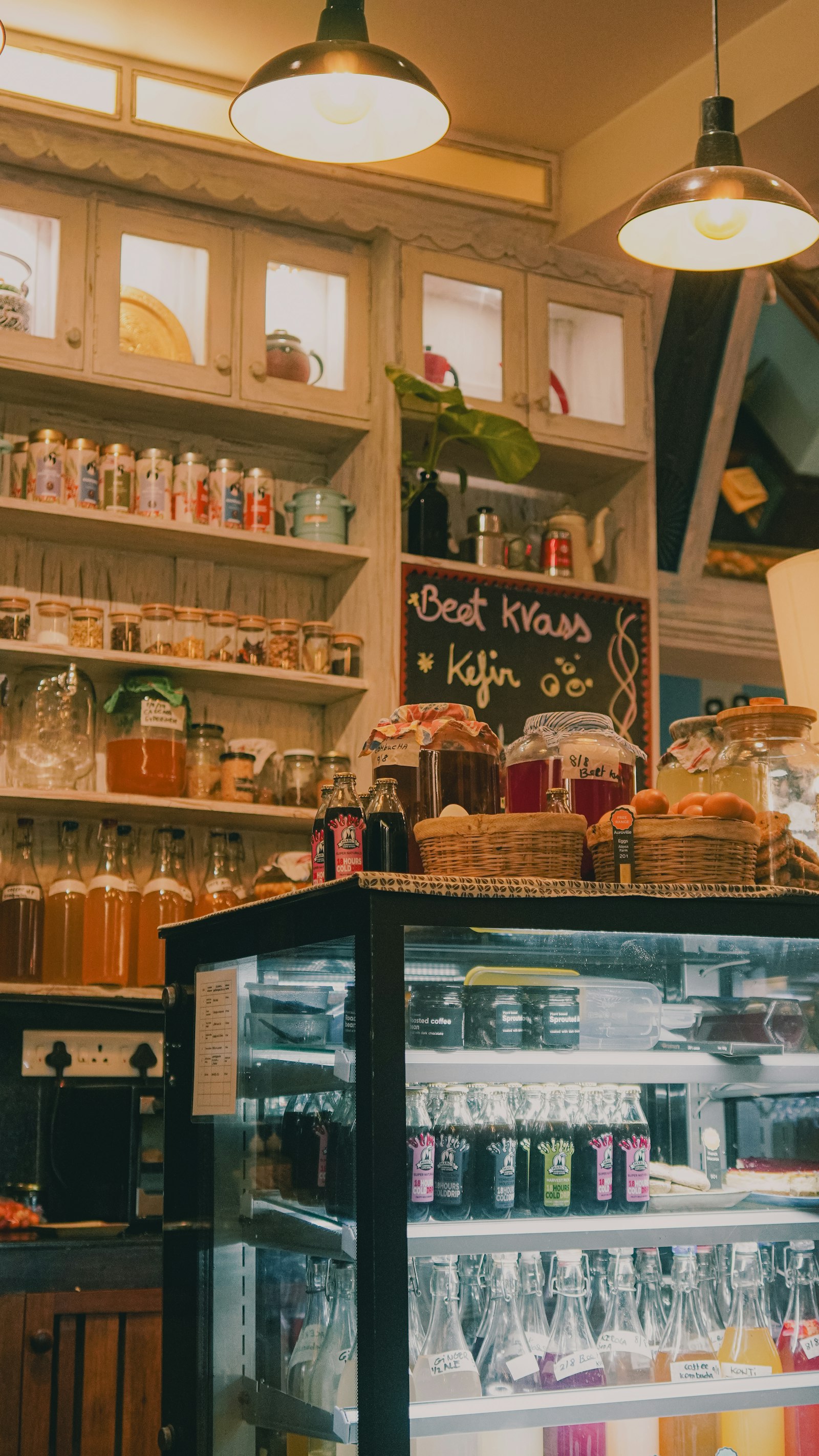 A bright local shop counter with warm wood and greenery — a small business of the kind Hivetivity modernizes